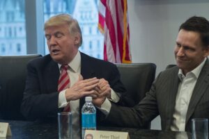 Donald-Trump-holds-hands-with-Peter-Thiel