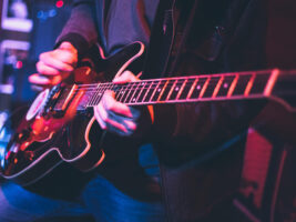 Person-playing-electric-guitar-on-stage-hero-credit-Brothers_Art-Getty402000x1500